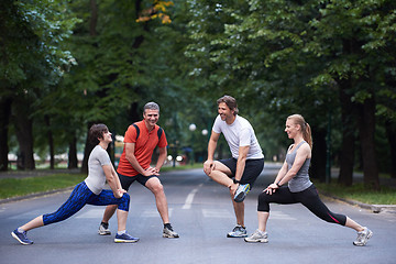 Image showing jogging people group stretching