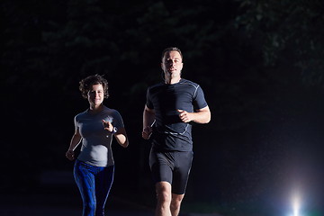 Image showing couple jogging at early morning