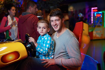 Image showing father and son playing game in playground