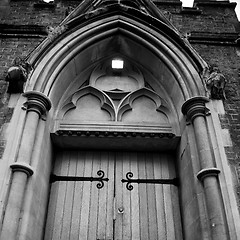 Image showing wooden parliament in london old church door and marble antique  