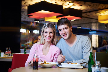 Image showing couple having lunch break in shopping mall