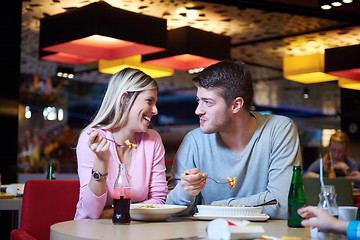 Image showing couple having lunch break in shopping mall