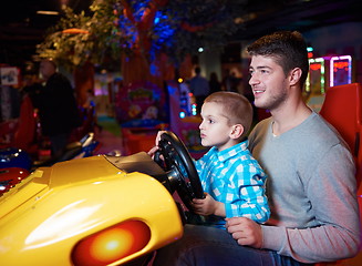 Image showing father and son playing game in playground