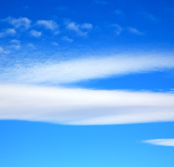 Image showing in the blue sky white soft clouds and abstract background