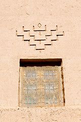 Image showing   window in morocco old construction and brown wall  