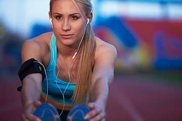 Image showing sporty woman on athletic race track