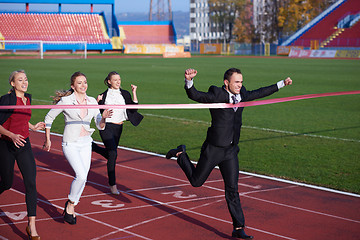 Image showing business people running on racing track