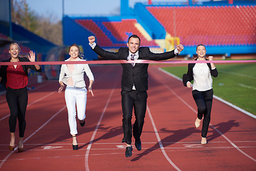 Image showing business people running on racing track