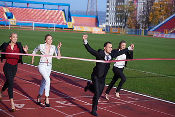 Image showing business people running on racing track