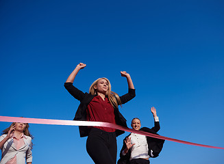 Image showing business people running on racing track