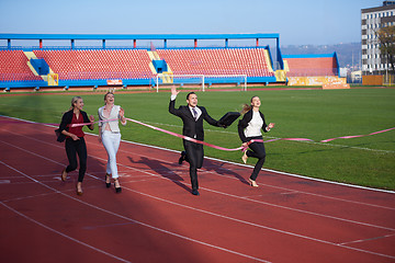 Image showing business people running on racing track