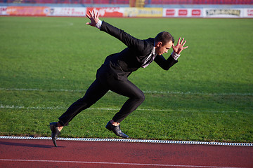 Image showing business man ready to sprint