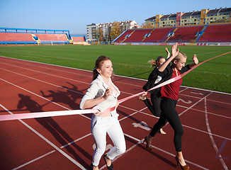 Image showing business people running on racing track