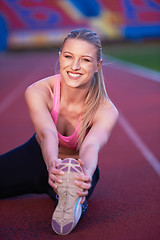 Image showing sporty woman on athletic race track