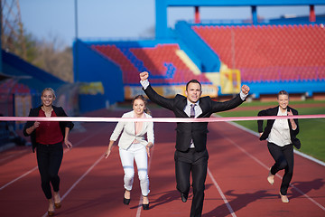 Image showing business people running on racing track