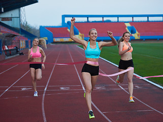 Image showing Female Runners Finishing Race Together