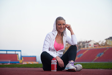 Image showing sporty woman on athletic race track