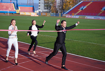 Image showing business people running on racing track