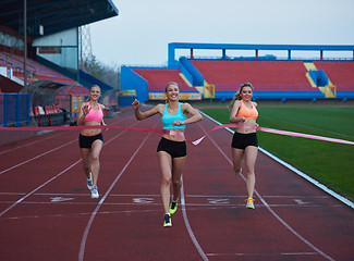 Image showing Female Runners Finishing Race Together