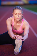 Image showing sporty woman on athletic race track