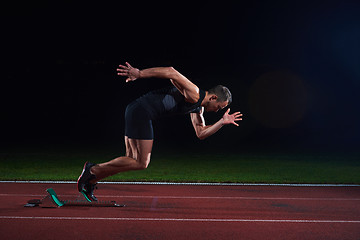 Image showing Sprinter leaving starting blocks