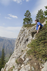 Image showing Tourist on a cliff