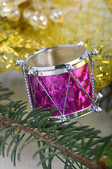 Image showing Christmas background with drums, green eve tree branch, golden new year decoration 