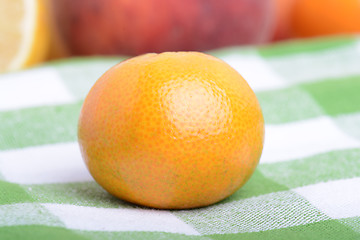 Image showing many different fruits for the health of the entire family, peach, mandarin, strawberry slices