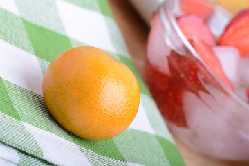 Image showing mandarin and strawberry slices as health food concept