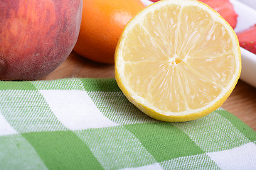 Image showing Close up of a cup of sliced strawberries with lemon