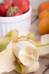 Image showing Fresh colorful fruits composition mandarin, bananas and orange