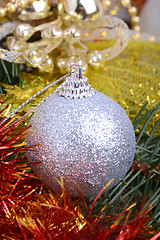 Image showing Closeup of Christmas balls and green fir tree branch, new year invitation card