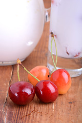 Image showing a delicious cherry milkshake on wooden plate