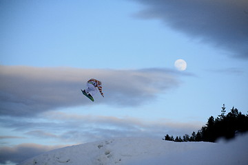 Image showing Snowboardjump with moon behind