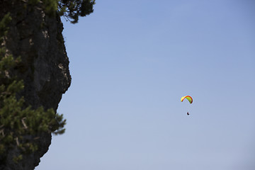 Image showing Paraglider flying over Bavarian mountains