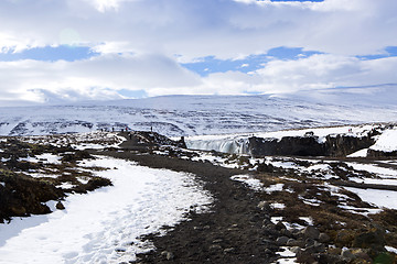 Image showing Tourists at the Icelandic waterfall Godafoss in wintertime