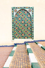 Image showing blue window in morocco africa   and brown wall  construction