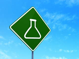 Image showing Science concept: Flask on road sign background