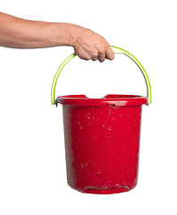 Image showing Human hand holding empty plastic pail