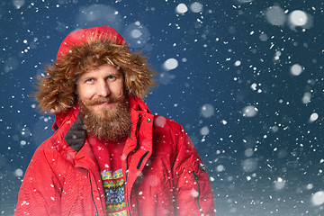 Image showing Handsome man in winter snow