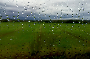 Image showing Raindrops on a train windows