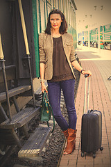Image showing woman on the steps of an old passenger rail car