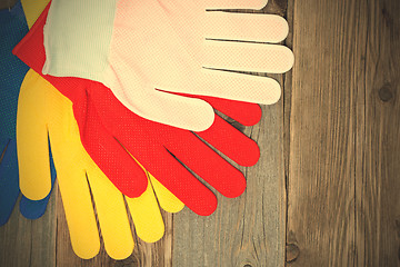 Image showing set of four colored construction gloves