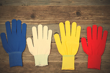 Image showing working multicolored gloves