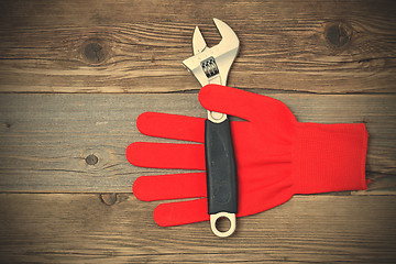 Image showing Red construction glove with wrench