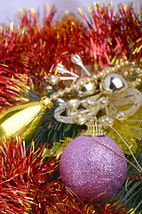 Image showing Closeup of Christmas balls and green fir tree branch, new year invitation card