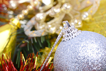 Image showing Closeup of Christmas balls and green fir tree branch, new year invitation card