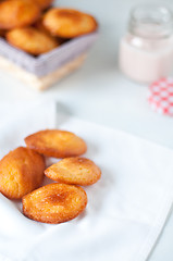 Image showing Madeleine small traditional French desserts with strawberries