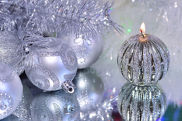 Image showing Christmas decorations with candle and silver balls.