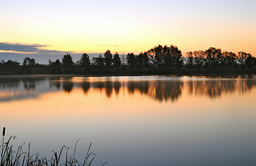 Image showing The morning landscape with sunrise over water in the fog